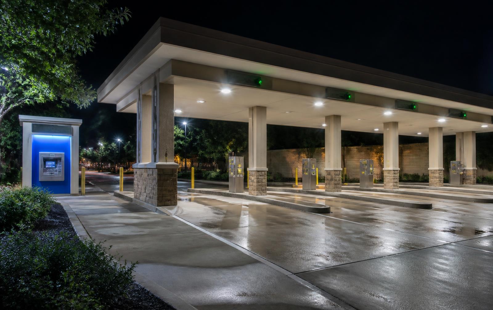 Bank branch drive-thru lane at night